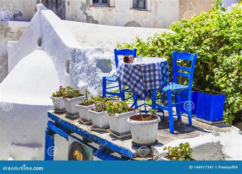 Traditional Greek Street Taverna With Blue Chairs Naxos Island