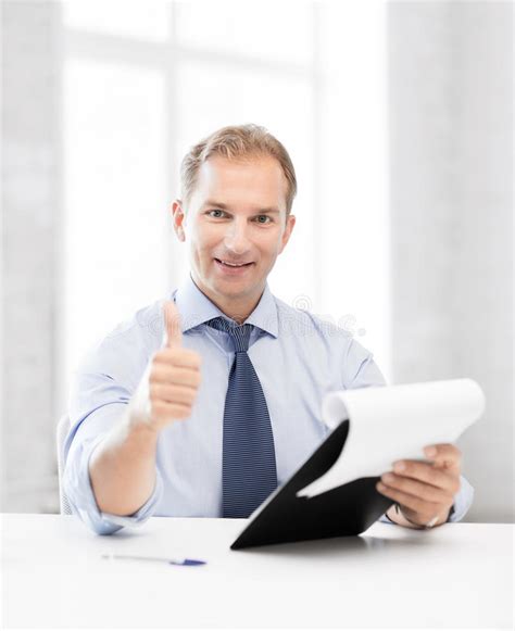 Businessman With Papers Showing Thumbs Up Stock Image Image Of