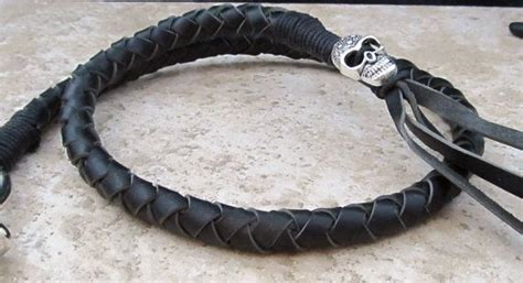 The get back whip displays the club colors. Motorcycle Get Back Whip Black Leather With by ...