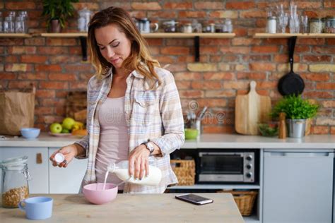Woman Making Cereals For A Breakfast Stock Photo Image Of Happy Girl