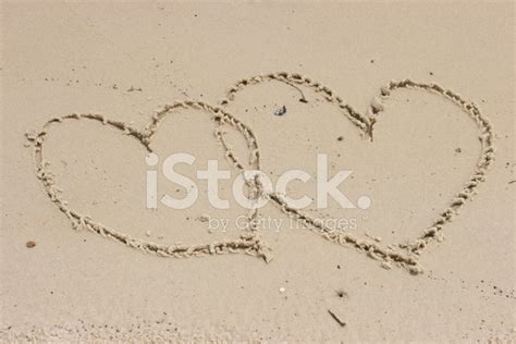 Two Hearts Drawn In Sand Stock Photo Royalty Free Freeimages