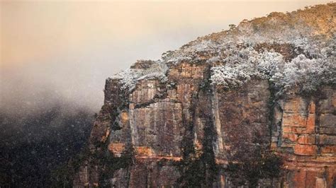 A Snow Covered Rocky Cliff At Echo Point Lookout Katoomba New South