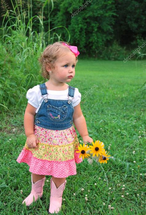 Do you have a cute kid? Cute toddler girl with flowers — Stock Photo © usalizard43 ...