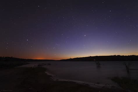 Smooth zodiacal light in the Lake @ Astrophotography by Miguel Claro