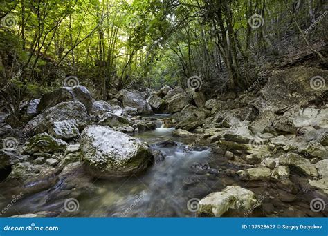 Beautiful Waterfall In Autumn Forest In Crimean Mountains Stones With