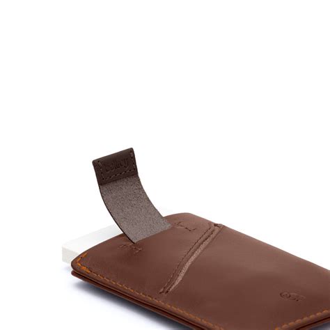It is currently holding 8 cards, 3 bills, and a check. Bellroy Card Sleeve Cocoa - Rowan Sky