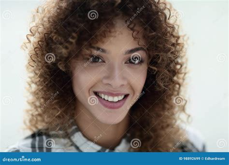 Portrait Of A Beautiful Young Woman With Curly Hair Stock Image