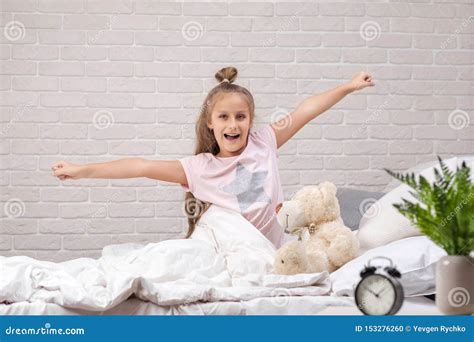 Little Child Girl Wakes Up From Sleep Stock Photo Image Of Pajama