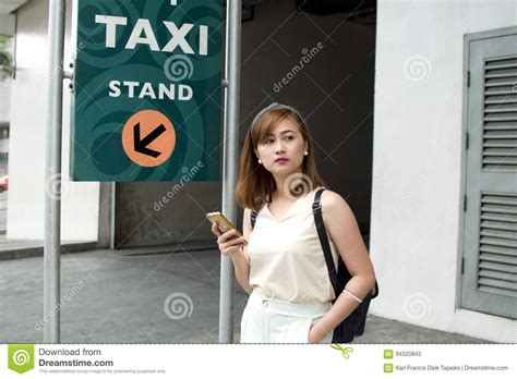 A Woman Is Waiting For A Cab Stock Image Image Of Transportation Adult 94320843
