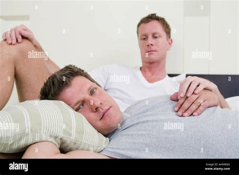 Gay Couple Laying In Bed Stock Photo Alamy