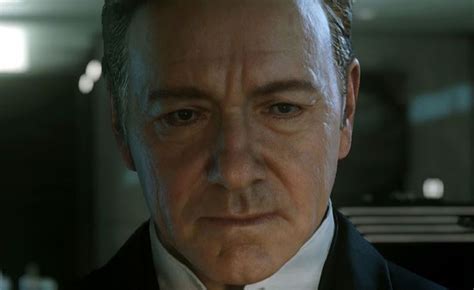 A Man In A Suit And Tie Looking At The Camera With An Evil Look On His Face