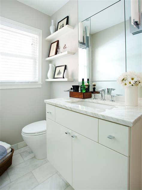 Practical wall mounted shelves for bathroom use. Small, White Bathroom With Floating Shelves and ...