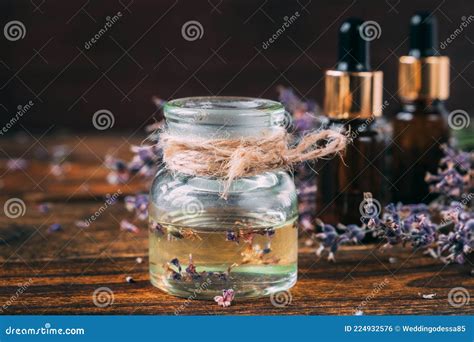 Lavender Oil In A Transparent Jar Stock Photo Image Of Wood Glass