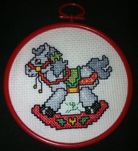 It's a baby cross stitch patterns dale burdett bears ducks lambs rocking horse. Baby-themed counted cross-stitch with a rocking horse and ...