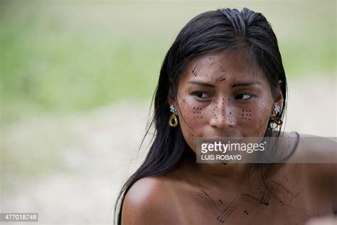 A Young Woman Of The Wounaan Nonam Indigenous Ethnic Group Looks On