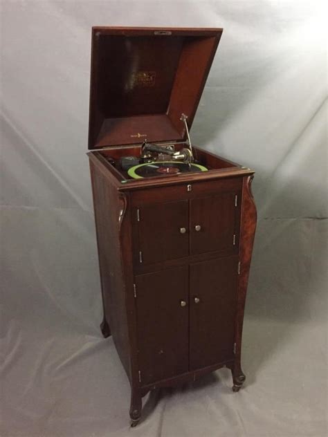 Cranks, brakes and speed controls 3. Antique Victrola in cherry cabinet with needle and working c