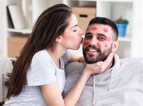 Photo Stock Woman And Man Man With Red Lipstick All Over His Face