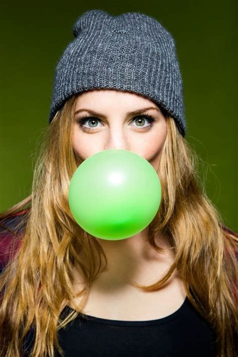 Premium Photo Woman Making A Green Bubble Gum With Mouth Green Bubble Blowing Bubble Gum