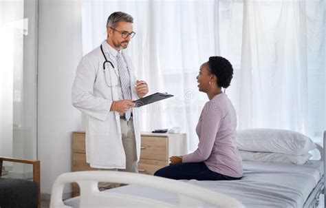 Consulting Medical And Doctor With Black Woman In Hospital For