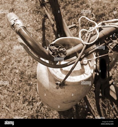 Ancient Milking Bicycle With The Old Aluminum Milk Can And Sepia Effect Stock Photo Alamy