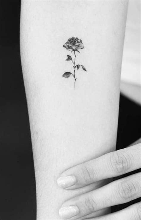 Try this beautiful tattoo design for a spectacular effect! 50+ Beautiful Rose Tattoo Ideas - MyBodiArt