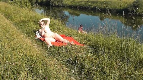 Riverside Naked Milf Sunbathing Is Not Shy About Random Fisher