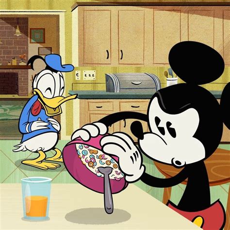 Mickey And Minnie Mouse Eating Together At The Kitchen Table