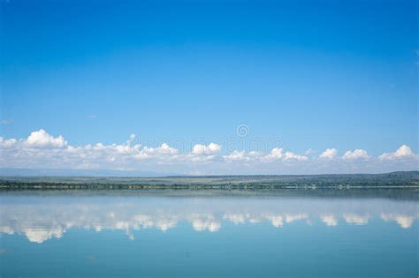 Blue Sky Reflected In Waters Of Elmenteita Lake Kenya Stock Photo