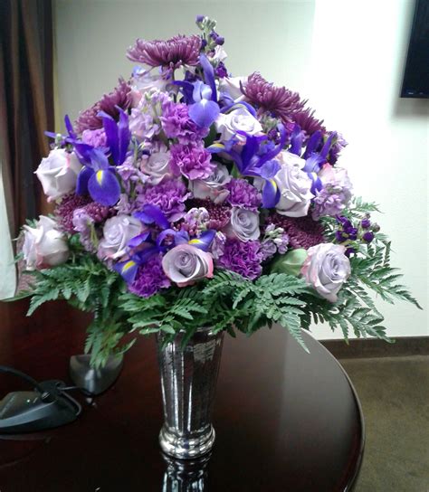 Purple Flower Arrangement With Iris Carnations And Lavender Roses