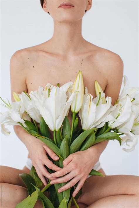 Closeup Portrait Of Unrecognizable Woman With Bouquet Of White Lilies By Stocksy Contributor