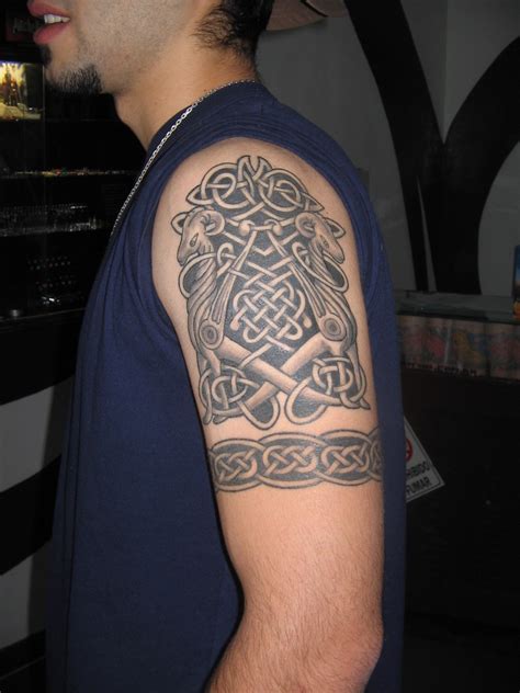 The tribal tattoo on the shoulder and arm of this guy is as amazing as his physique. Outstanding Tribal Arm Tattoo Designs For 2011 Tribal Arm ...