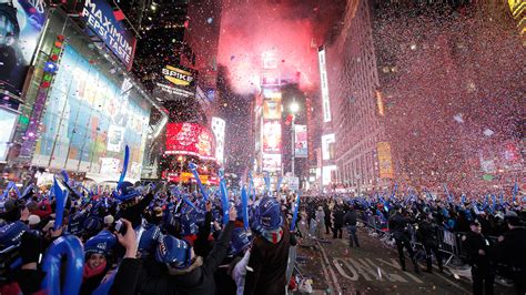 Revellers Cheer As Confetti Falls During New Year Celebrations In Times