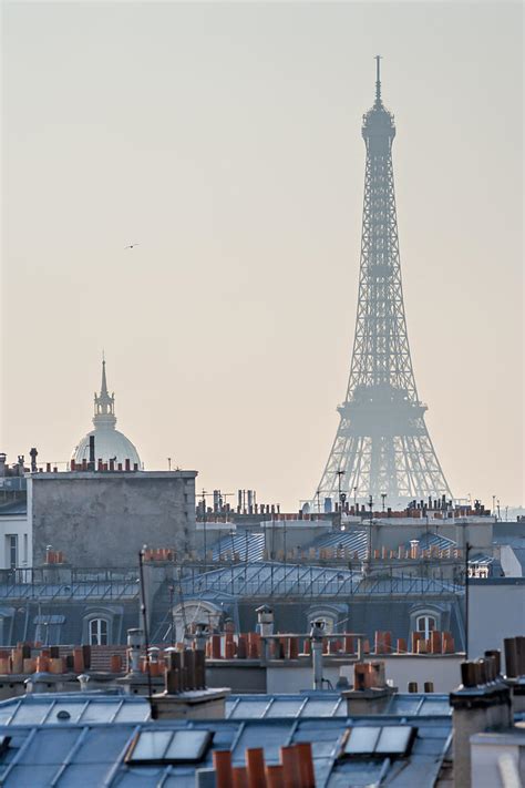 Photothèque Arnaud Frich La Tour Eiffel Les Toits De Paris Et Le