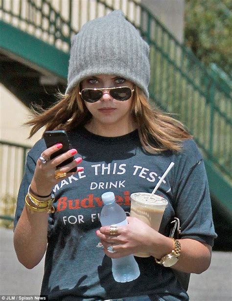 Ashley Benson Wears Thick Knit Cap With Her Daisy Dukes Despite The