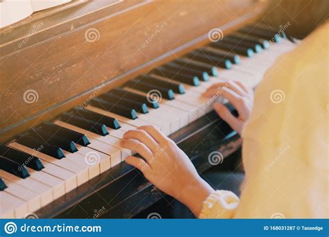 A Woman Playing Piano In Her Room Stock Image Image Of