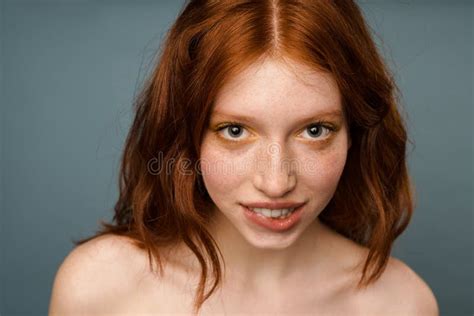 Shirtless Ginger Woman Showing Her Tongue And Looking Aside Stock Image