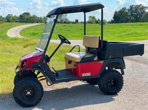 Lot Preview Of Lot Number 999 E Z Go Golf Cart With Dump Bed And Trailer