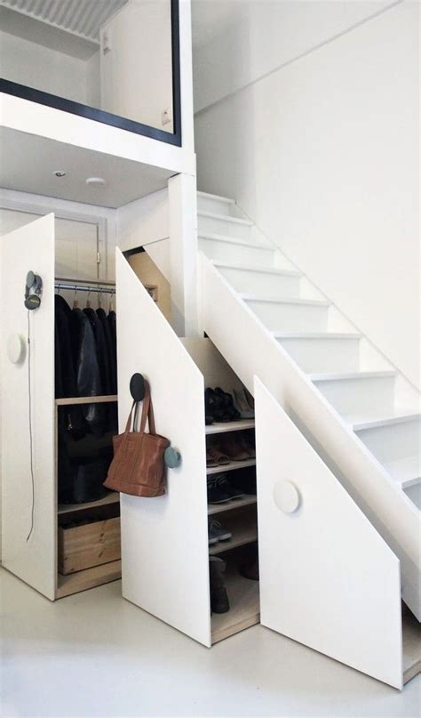 Design a closet under the stairs that looks like the support wall, but holds space to store shoes and coats at the entrance area. Inspiration: Small Spaces - Kingston Lafferty Design