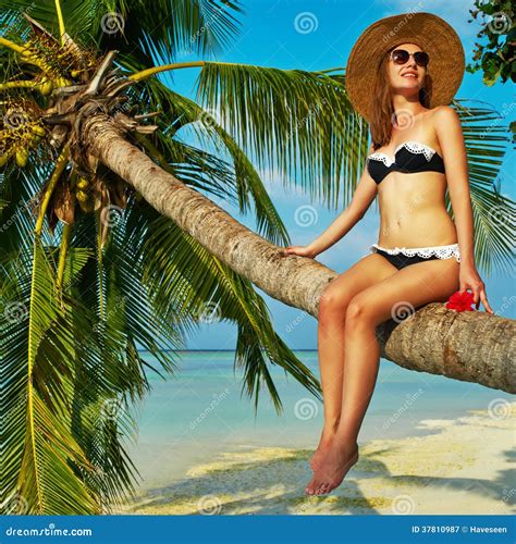 Woman Sitting On A Palm Tree At Tropical Beach Stock Image Image Of