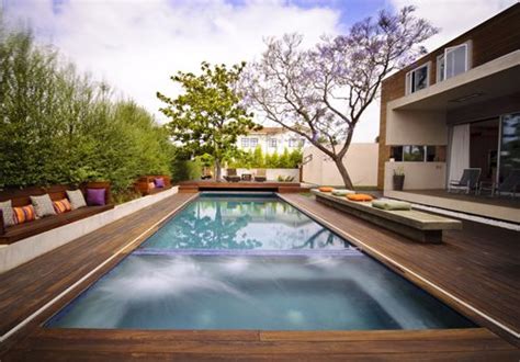 Wooden decks can be an expensive option if you use luxury woods such as redwood or ipa wood, but can be more cheaply built with less expensive woods. Modern Ipe Pool Deck - Landscaping Network