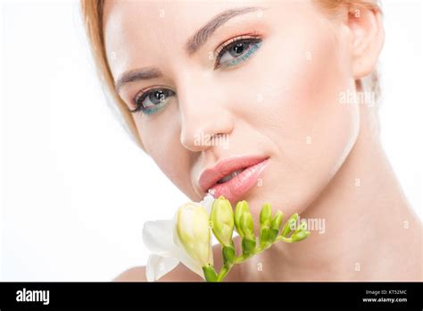 Beautiful Blonde Woman With White Flower Near Face Looking At Camera Skincare Concept Stock