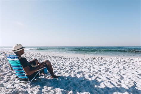 Black Man Relaxing On The Beach Creative Flame Media