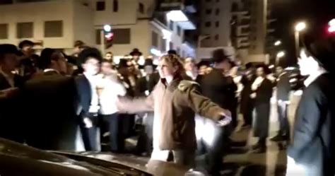female israeli soldier fends off dozens of ultra orthodox anti draft protesters attacking her