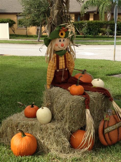 Scarecrow Pumpkin And Hay Bales Cute Fall Display And Photo Op For