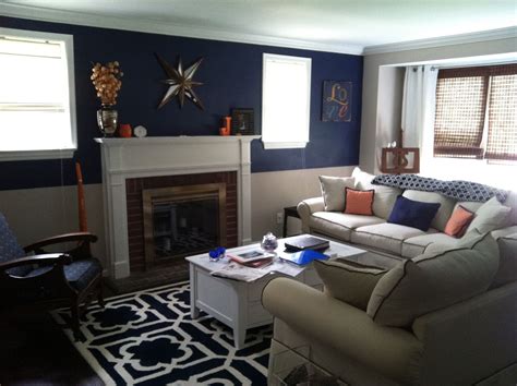Navy blue sofa, loveseat and chair with matching throw pillows, paired with a light gray rug. Navy Grey Living Room - Modern House
