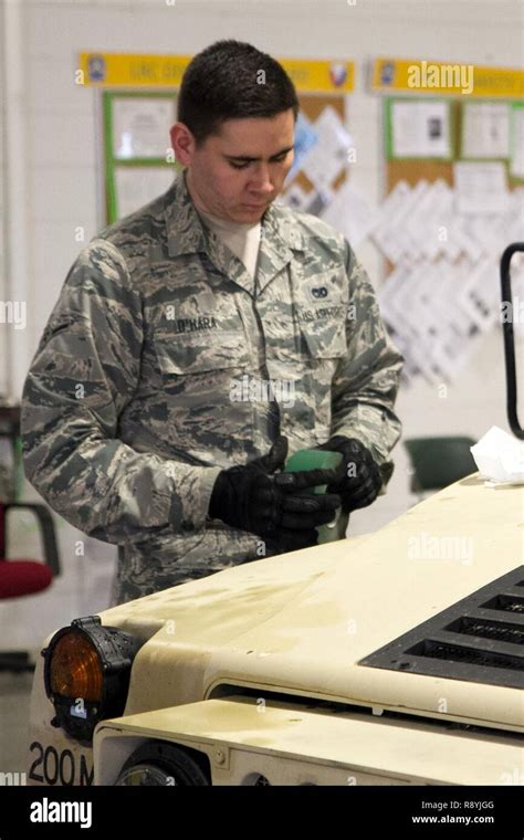 A Us Airmen Marks The Weight Of An Up Armored Humvee At Joint Base