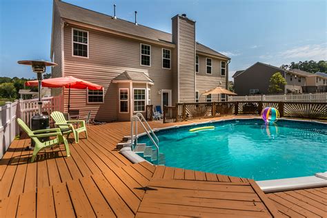 Beautifully landscaped brick and vinyl 4 bedroom, 2 bath home. JUST LISTED...North Charlotte Home for Sale with Swimming Pool