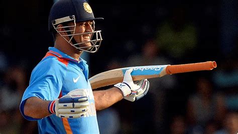 Smiley Ms Dhoni With Bat Is Wearing Blue Sports Dress And Helmet Dhoni