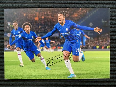 The 20 year old is 6 feet and earns a weekly salary of £100,000 per week due to his new contract. Signed Reece James Chelsea photo - AMCK Football Memorabilia