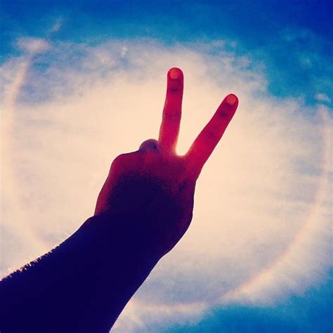 rainbow around the sun in byron bay 🌈🌀 ️ peace gesture rainbow byron bay